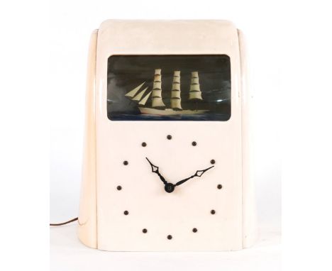 VITASCO-E, A MID 20TH CENTURY CREAM BAKELITE 'SEA SHIP' MANTEL CLOCK24cm wide; 34cm highCondition Report:Discolourtion to the