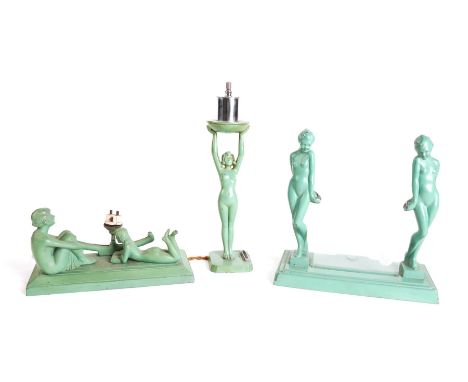 AN ART DECO GREEN ENAMEL METAL FIGURAL TABLE FRAME, STAND AND LAMP (3)The frame, 23cm wide;  23cm high; The figural base inci