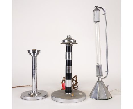 A GROUP OF THREE CHROME-PLATED TABLE LAMPS (3)Two of column form with weighted bases, the other with a faceted base and tubul