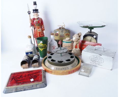 A GROUP OF MID 20TH CENTURY ADVERTISING ITEMSIncluding Homepride kitchen scales, Dubonnet tray, Brands meat paste shop stand,