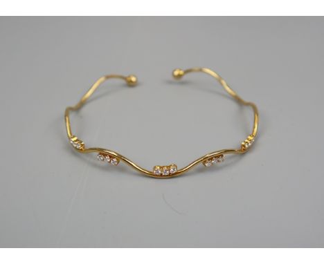 Gold and diamond bangle 