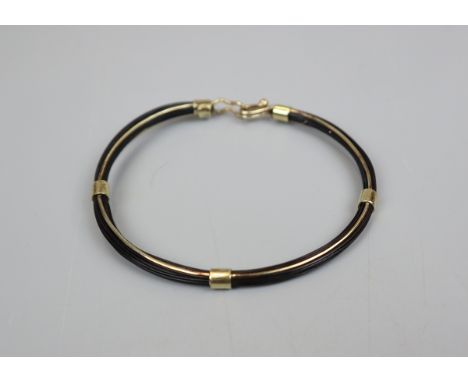 Gold and elephant hair bangle 