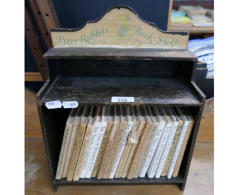 Vintage collection of Beatrix Potter books in Peter Rabbit book shelf 