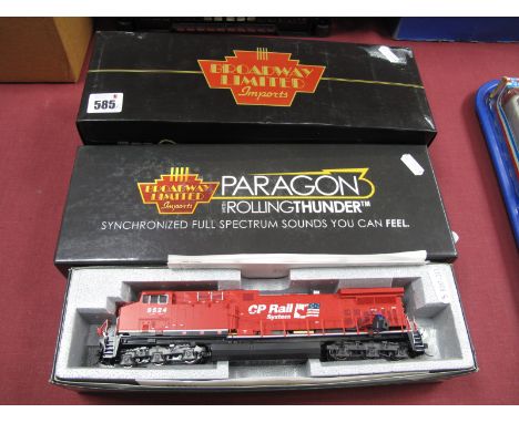 Three 'HO' Gauge U.S.A Outline Boxed Locomotives - A Kato Diesel Ref No 37-6471, C.P Rail GEAC44 R/No 9524, body loose to cha