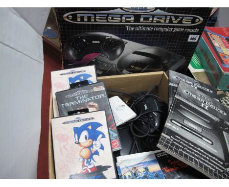 Retro Gaming - A Boxed Sega Mega Drive II 16-Bit, with instruction manual and a quantity of boxed games, including The Termin
