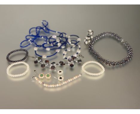 A collection of seven various cultured pearl bracelets, two pairs of cultured pearl cluster drop earrings, a lapis lazuli and