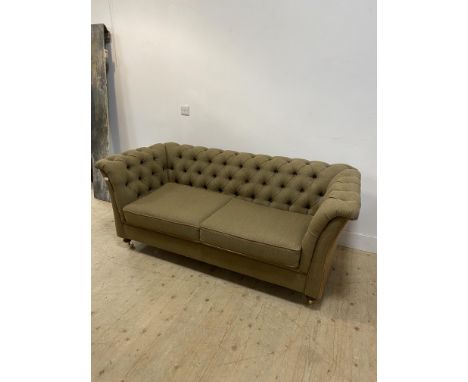 Tweed chesterfield sofa with a button back and sides with two loose seat cushions, the outer sides covered in brown leather, 