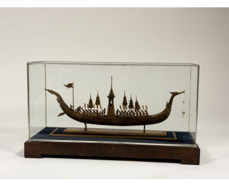 A miniature scale replica model of a Thai Suphannahong Royal Barge incased within a fitted display box. (h-22.5cm l-40cm)