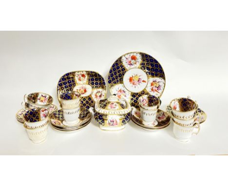 A late 19th century Coalport china part tea service, decorated in royal blue and gold on a white ground with floral motifs, t