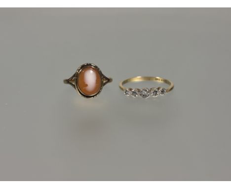 A 9ct gold oval cameo set ring M 1.65g and an 18ct gold and platinum mounted five stone diamond point ring cut Q 1.93g (2)