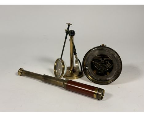A three draw mahogany brass telescope (a/f), a desk brass magnifiing glass on stand with smaller hand held magnifying glass t