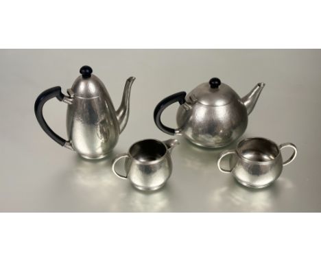 A stylish late1920s Liberty &amp; Co of London pewter four-piece tea and coffee service with hand planished finish and bakeli