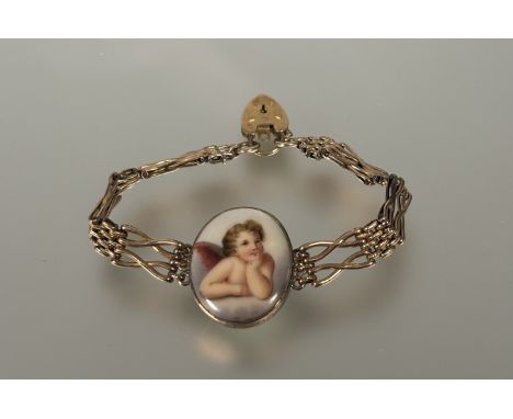 A 9ct gold gate link bracelet mounted with an oval yellow metal ceramic cherub panel and heart shaped padlock: d. x 7cm 15.69