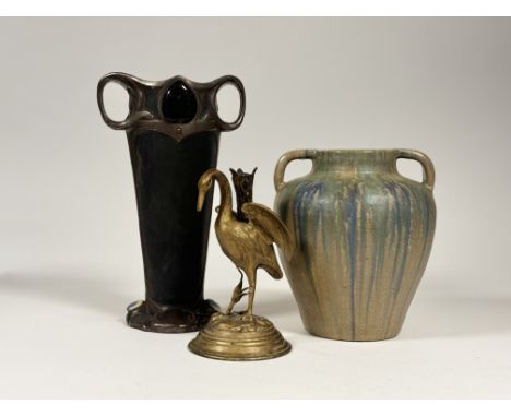 An Art Nouveau twin handled vase with enamelled panel to top and base(h-35cm), an Upchurch pottery twin handled vase (h-26cm)