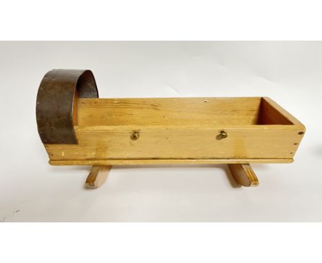 A wooden children's doll cradle with metal arch roof and brass screws to sides on swinging bases (l. 52 x w. 19.5cm x h. 30cm