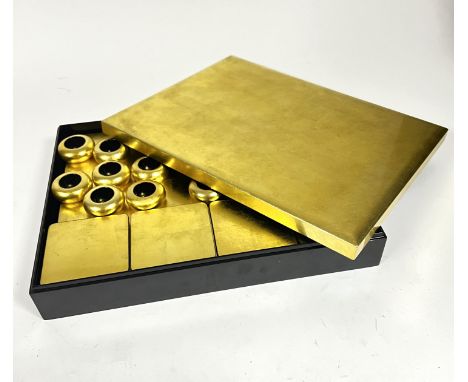 A handmade Vietnamese black and gold lacquered set of eight placemats (l. 39cm x w. x 29cm), eight coasters (10cm x 10cm), an