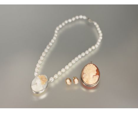 A freshwater cultured pearl necklace mounted with white metal framed shell carved oval cameo portrait: l x 24cm, an Edwardian