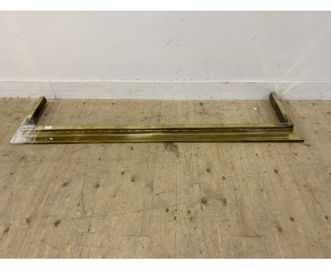 19th century large brass hearth fender, with husk decoration above a reeded border, 166cm long x 38.5cm deep 