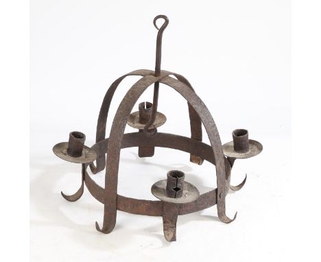 of domed form and having four candlestick sockets above meat hooks, 39cm high.