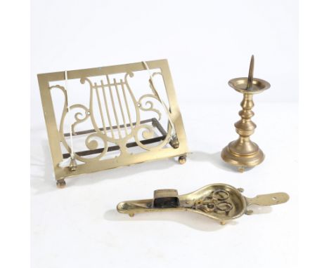 the scissor action candle snuffers on a shaped tray, 26cm wide, the pricket candlestick with waisted stem and three scrolled 