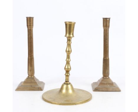 the pair having a plain socket and stem with a incised floral decoration raised on a stepped square foot, 31.5cm high togethe