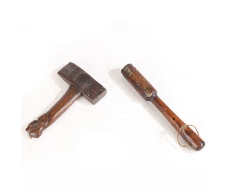 the turned fruitwood priest with stylised hearts to the terminal, with lead weighted interior, 26cm long, the axe/hammer with