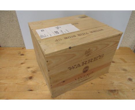 12 bottes 2003 Warre's Vintage Port, OWC (Est. plus 21% premium inc. VAT)