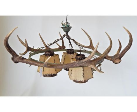 Taxidermy: Red Deer Antler Mounted Chandelier, constructed from a central metal ring with leaf mountings, three adult Red Dee