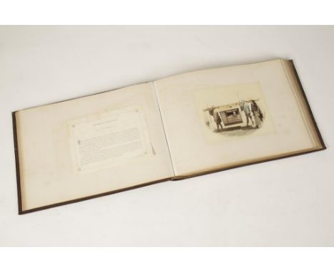 AN EARLY PHOTOGRAPH ALBUM containing numerous black and white photographs highlighted with colour depicting scenes of Japan w