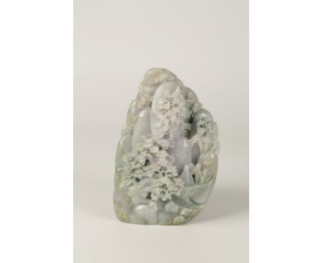 A CHINESE JADE MOUNTAIN in the Qianlong style, carved with figures on rocky promontories, on a rock strewn hillside with gnar