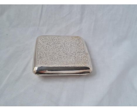 A cigarette case curved body engraved with scrolls B'ham 1918 110 gms 