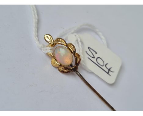 A fancy gold stick pin set with a solitaire opal - 8mm x 6mm (pin&nbsp; not gold)