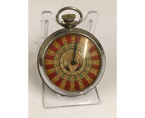 A vintage gaming pocket watch (when wound the mechanical arm spins round landing randomly on a different marker each time