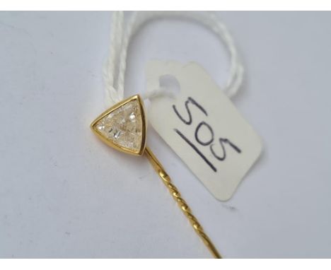 A gold stick pin with large Trillion diamond