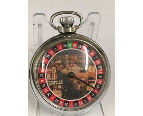 A vintage gaming pocket watch (when wound the mechanical arm spins round landing randomly on a different marker each time