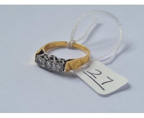 A three stone diamond ring in 18ct gold - size Q.5 - 4gms
