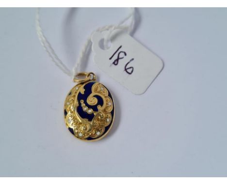 A blue &amp; white enamel pendant set in gold