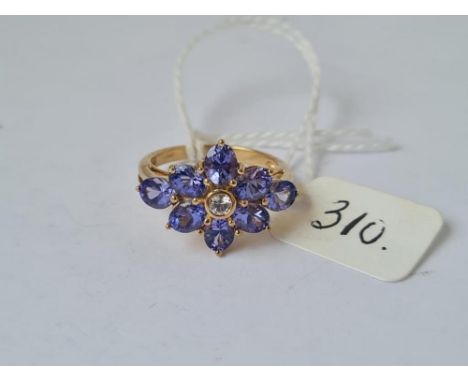 A good quality  tanzanite &amp; diamond cluster ring in 9ct - 8 tanzanite's with central diamond - size N - 4.2gms