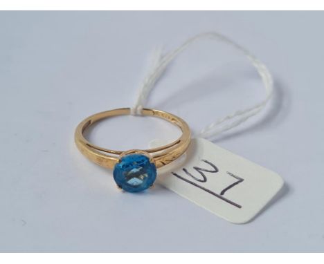 A blue stone ring in 9ct - size Q - 1.8gms 