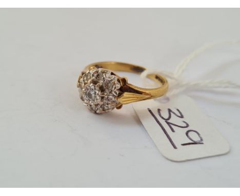 A diamond cluster ring in 18ct gold - size M - 3.7gms