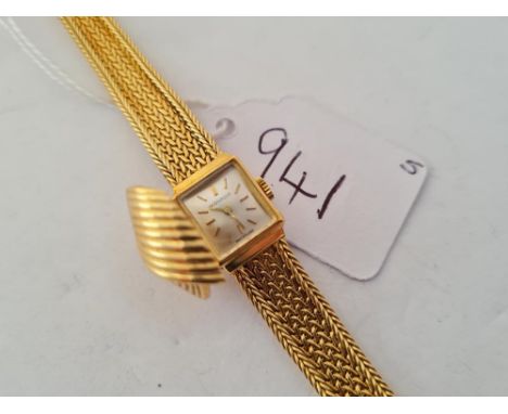 A VINTAGE NOMADO LADIES WRIST WATCH WITH SECRET HIDDEN CLASP IN 18CT GOLD WITH 18CT GOLD FANCY STRAP - 28.8gms