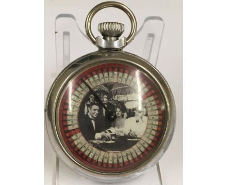 A vintage gaming pocket watch (when wound the mechanical arm spins round landing randomly on a different marker each time