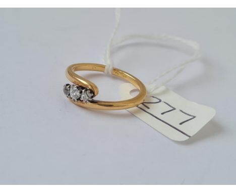 A diamond ring, 3 old cut diamonds set on twist in 18ct gold - size J - 3gms