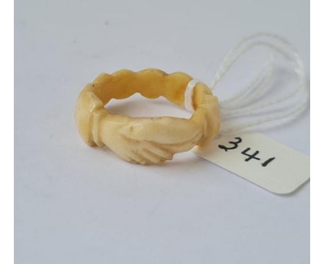 An antique ivory fede hands ring 