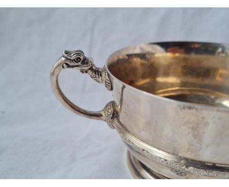 A Celtic style 2 handle bowl on rimmed foot 6 inches over handles B'ham 1957 201 gms 