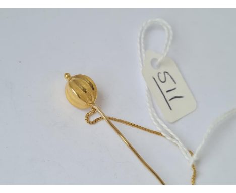 A jabot style gold stick pin with balloon terminal in high carat gold 