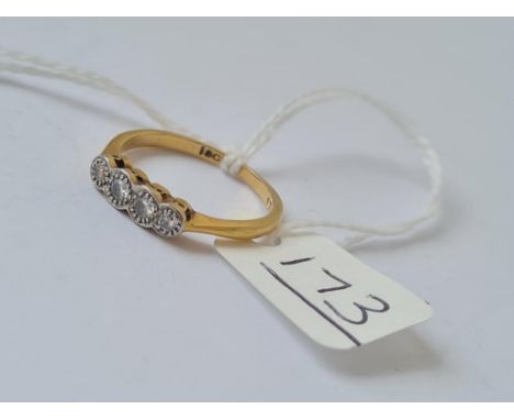 A 4 stone diamond ring in 18ct yellow gold - marked 18ct - size K.5 - 2.4gms