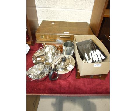 A plated three-piece tea service marked 'BH Ltd', two canteens of plated cutlery in fitted boxes, loose cutlery and other pla