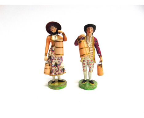 A PAIR OF ENGLISH PORCELAIN FIGURES  finely modelled as a milkmaid and her gentleman companion, with polychrome enamel and gi