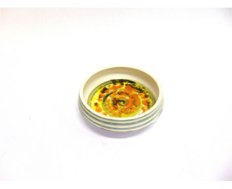 A POOLE POTTERY BOWL  probably 1970s, with ribbed exterior and trailed spiral decoration, 19cm diameter